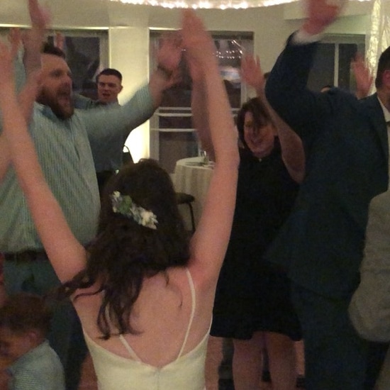 bride dancing with guests at Mariners Church in Portland, Maine